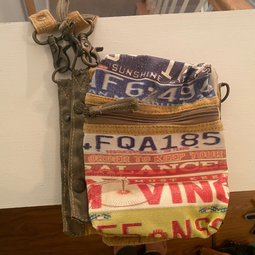 Purse. License plate theme. Foldable into different sizes. Brand new with tags